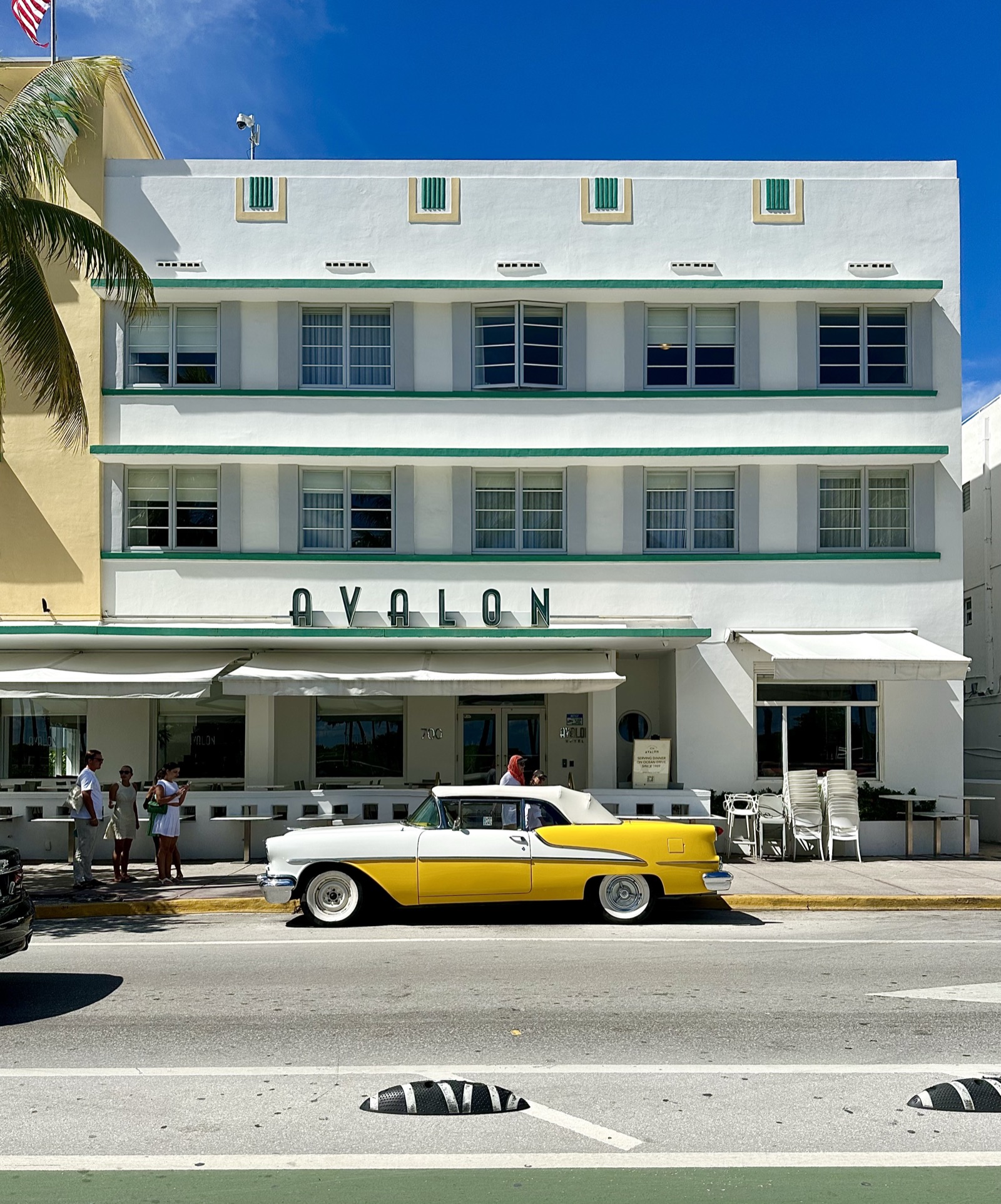 A picture Joyce took of a white building and yellow car in Ocean Drive Miami South Beach